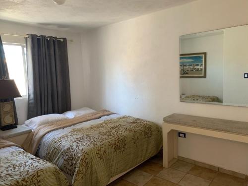 En eller flere senge i et værelse på San Carlos Sonora Casa Caracol Condominio