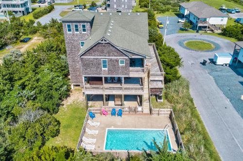 an aerial view of a house with a swimming pool at 2BNWaves #2-W in Waves