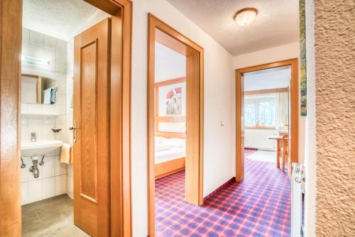 a bathroom with a sink and a mirror at Pension Weirather in Imst