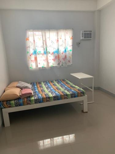 A bed or beds in a room at KDorm