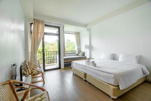 Una cama o camas en una habitación de The Dearly Koh Tao Hostel-PADI 5 Star Dive Resort