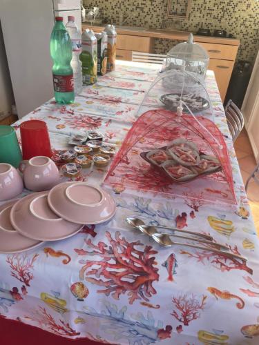 a table with a table cloth with food on it at Centro estivo Il Piccolo Paradiso in Sonnino