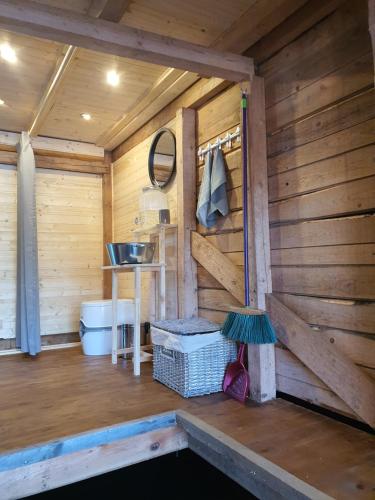 a bathroom in a wooden cabin with a sink at Mr.Banga in Alūksne
