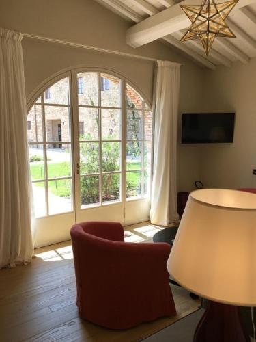 Télévision ou salle de divertissement dans l'établissement La Pietra Del Cabreo