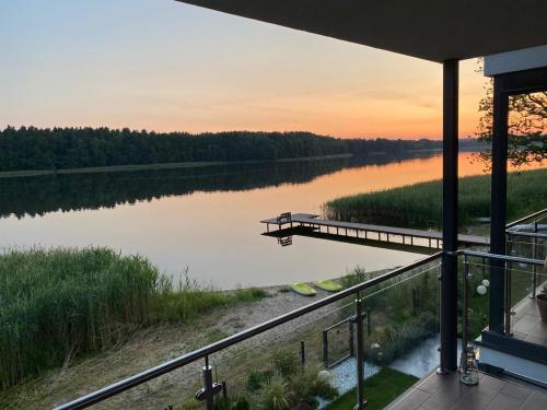 a view of a river from a house at Apartamenty Mazurskie Klimaty (Cud Natury) in Tomaszkowo