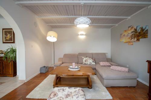 a living room with a couch and a table at Villa Ruza in Selina