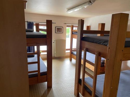a room with four bunk beds in a room at Gîte La Semois in Chiny