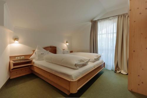 Кровать или кровати в номере Johanneshof Apppartements
