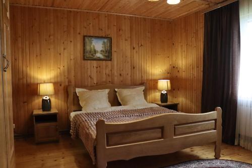 Postel nebo postele na pokoji v ubytování Садыба Полыцька