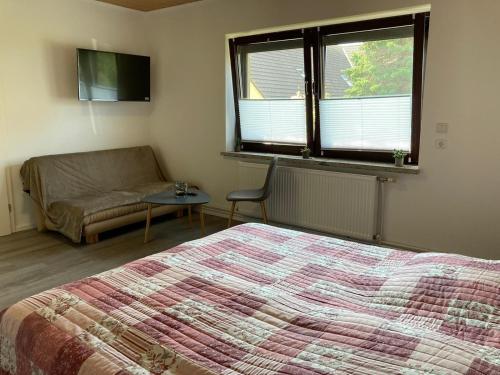 Katil atau katil-katil dalam bilik di Ferienhaus Kuddel