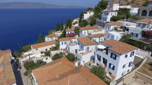 an aerial view of a village next to the ocean at Options House in Hydra