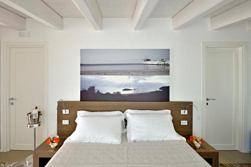Säng eller sängar i ett rum på Dimora Del Dragone