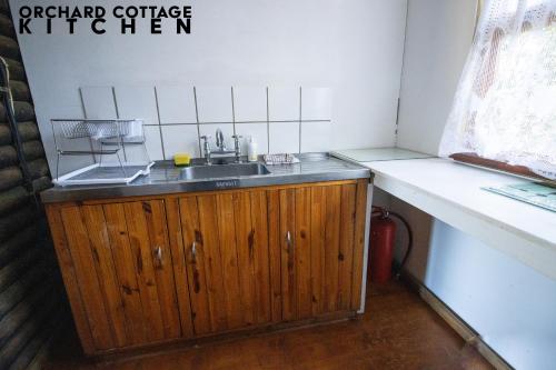 a kitchen with a sink and a counter at JAYA'S PLACE in Hogsback