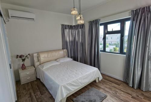 Ένα ή περισσότερα κρεβάτια σε δωμάτιο στο Villa Aussee Mauritius