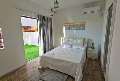 A bed or beds in a room at Villa Aussee Mauritius