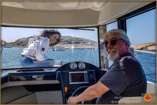 an older man sitting in the front of a boat at Hem till Bengt in Kungshamn