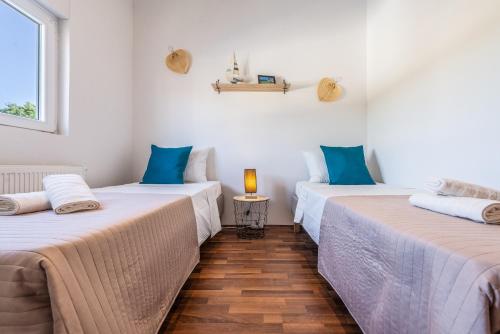 Postel nebo postele na pokoji v ubytování Apartman Luka