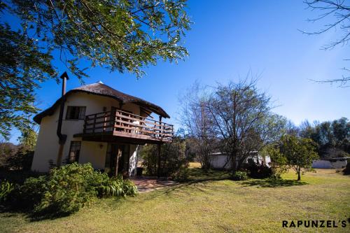 an old house with a porch and a balcony at JAYA'S PLACE in Hogsback