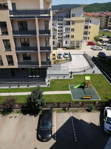 a car parked in a parking lot in front of a building at Art House in Floreşti