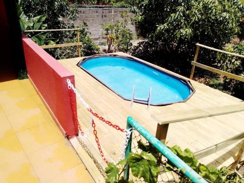 a swimming pool on top of a wooden deck at Villa Lomo Fragoso in San Sebastián de la Gomera