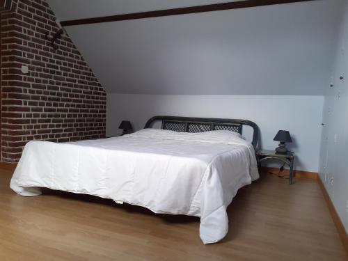 Кровать или кровати в номере La Maison de l'Isle