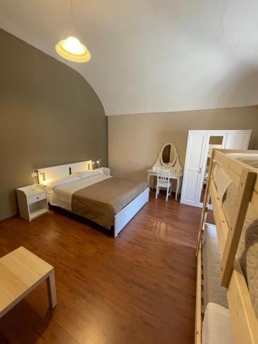 a bedroom with a bed and a desk and a table at B&B La Casetta in Villa Santa Maria