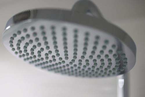 a close up of a shower head at MUSTARD HOTEL SHIMOKITAZAWA in Tokyo