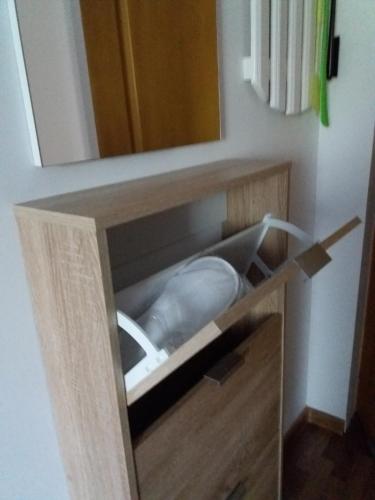 a wooden drawer with a mirror in a bathroom at DOBRA RAKIJA - transit sleep in Dobra