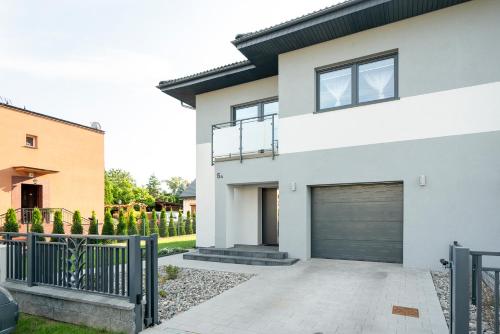 a white house with a garage at JULIA in Reda
