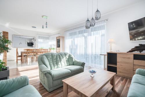 a living room with a couch and a table at JULIA in Reda