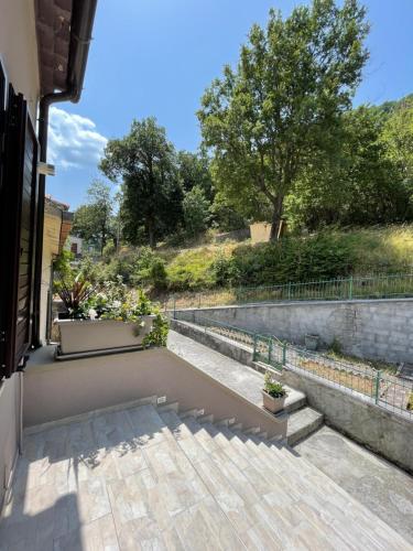 a patio with potted plants and a fence at B&B La Casetta in Villa Santa Maria