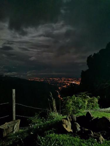 a view of a city at night with a fence at Casa de campo Jaulares in Alaska