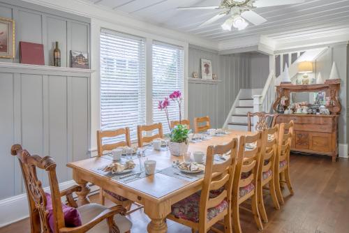 a dining room with a table and chairs at Inn St Helena in St. Helena