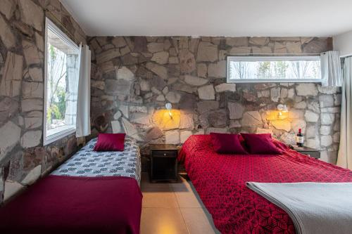 Кровать или кровати в номере La Agustina Complejo Apart