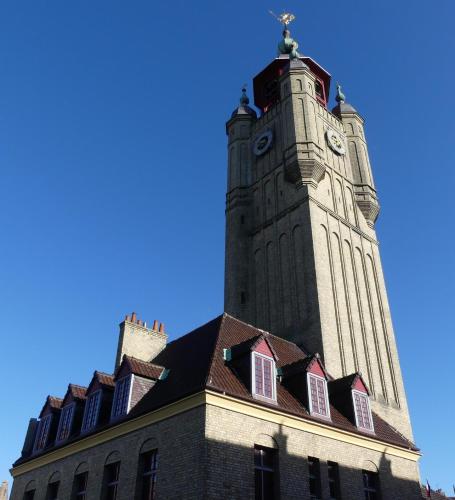 a building with a clock tower on top of it at chambres d'hôtes Le Carillon in Bergues