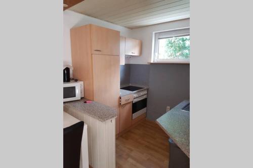 Nhà bếp/bếp nhỏ tại Schöne Wohnung in Karben - Rendel, mit Freisitz