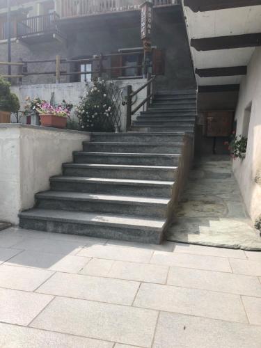 a set of stairs in a building with potted plants at Affittacamere Buenavista Guest House in Champoluc