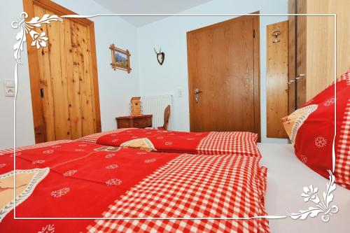 Postel nebo postele na pokoji v ubytování Haus Bartlmä