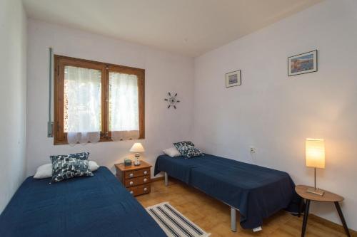 Postel nebo postele na pokoji v ubytování K-4 CALELLA DE PALAFRUGELL, 4 Pax
