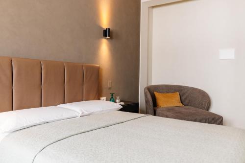 Ένα ή περισσότερα κρεβάτια σε δωμάτιο στο Hotel Bella Napoli ristorante & spa