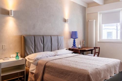 Ένα ή περισσότερα κρεβάτια σε δωμάτιο στο Hotel Bella Napoli ristorante & spa