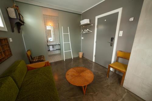 a living room with a couch and a table at Hotel Siglunes in Siglufjörður