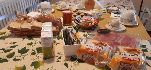 a table topped with a table with food on it at Le Fornaci in Castelfidardo