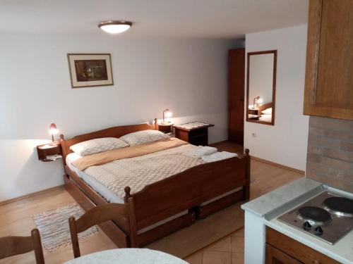 Postel nebo postele na pokoji v ubytování Apartments Ivanis