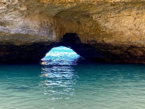 a cave in the middle of the water at Albufeira Oldtown 330ft Beach Private garage AC Wifi in Albufeira
