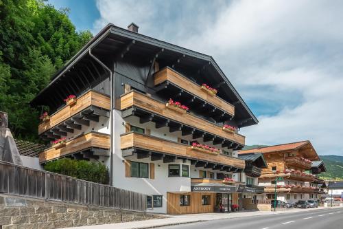 a building on the side of a road at Boutique Hotel ANYBODY in Saalbach Hinterglemm