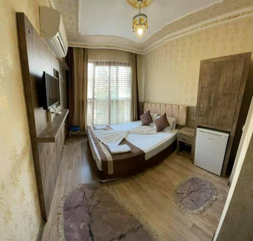 Un ou plusieurs lits dans un hébergement de l'établissement Özgür Hotel