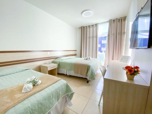 Кровать или кровати в номере Pousada Villa Mares