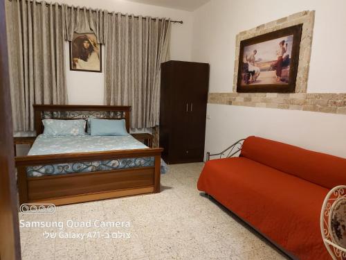 Tempat tidur dalam kamar di Paradise Rabab Apartment & Guesthouse