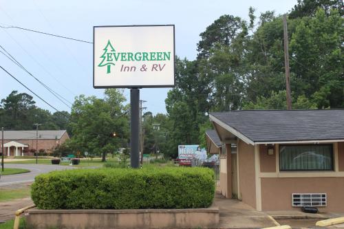 a sign for a evergreen inn and rv at Evergreen Inn and R.V. in Winnfield
